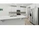 Contemporary kitchen with white cabinets, stainless steel appliances, light countertops and a spacious island at 1730 Pie Filling Dr, Haw River, NC 27258