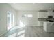 Bright and airy living space with modern flooring and sliding glass doors at 1730 Pie Filling Dr, Haw River, NC 27258