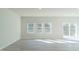 Spacious living area with modern flooring, multiple windows, and ample natural light at 1730 Pie Filling Dr, Haw River, NC 27258
