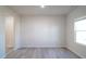 Bright and spacious living space with modern wood-look flooring and natural light at 1730 Pie Filling Dr, Haw River, NC 27258