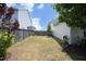 Fenced backyard featuring a grass lawn with minimal landscaping at 1940 Dunfield Dr, Fuquay Varina, NC 27526