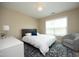 This cozy bedroom offers a comfortable bed, a chair, and plenty of natural light at 1940 Dunfield Dr, Fuquay Varina, NC 27526