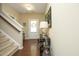 Welcoming foyer features hardwood floors, elegant decor, and a staircase leading to the upper level at 1940 Dunfield Dr, Fuquay Varina, NC 27526