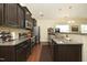 Modern kitchen with granite countertops, stainless steel appliances, and ample cabinet space at 1940 Dunfield Dr, Fuquay Varina, NC 27526