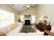 Cozy living room with a fireplace, comfortable seating, and ample natural light for relaxation at 1940 Dunfield Dr, Fuquay Varina, NC 27526