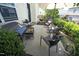 Outdoor patio area with bench, chairs, and lush landscaping at 1940 Dunfield Dr, Fuquay Varina, NC 27526