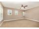 Bright and airy bedroom with neutral carpet and multiple windows allowing for plenty of natural light at 196 Norwich Dr, Clayton, NC 27520