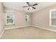 Cozy bedroom features neutral carpet and large windows offering plenty of natural light at 196 Norwich Dr, Clayton, NC 27520