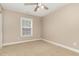 Comfortable bedroom offers neutral carpet and a bright window at 196 Norwich Dr, Clayton, NC 27520