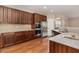 Spacious kitchen featuring stainless steel appliances, ample storage, beautiful counter tops, and hardwood floors at 196 Norwich Dr, Clayton, NC 27520