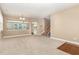 An open living room includes neutral paint, a stairway, and an open view to a sunroom at 196 Norwich Dr, Clayton, NC 27520