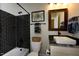 Modern bathroom featuring a tiled shower, stylish vanity, and decorative accents at 211 George Hudson Rd, Siler City, NC 27344