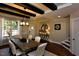 Dining room with a rustic wood table, bright lighting, and wood flooring at 211 George Hudson Rd, Siler City, NC 27344