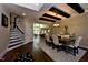 Open-concept dining room adjacent to the living room, featuring hardwood floors and stylish decor at 211 George Hudson Rd, Siler City, NC 27344