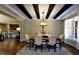 Open-concept dining room flows into a modern kitchen, complete with hardwood floors at 211 George Hudson Rd, Siler City, NC 27344