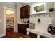Well-organized mudroom with cabinetry, bench seating, and a walk-in pantry for efficient storage at 211 George Hudson Rd, Siler City, NC 27344