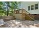 Multi-level back deck with stairs leading to the home's backyard at 215 Rocky Point Ct, Fuquay Varina, NC 27526
