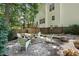 Backyard with deck, chairs, and fire pit perfect for outdoor gatherings at 215 Rocky Point Ct, Fuquay Varina, NC 27526