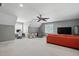 Well-lit living room with study area, TV, and comfortable seating at 215 Rocky Point Ct, Fuquay Varina, NC 27526