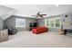Spacious living room with TV, comfortable seating, and bright natural light at 215 Rocky Point Ct, Fuquay Varina, NC 27526