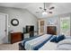 Spacious main bedroom features a vaulted ceiling, neutral paint, and large windows at 215 Rocky Point Ct, Fuquay Varina, NC 27526