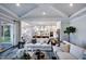 Bright living room with hardwood floors, open to the kitchen, and modern decor at 217 George Hudson Rd, Siler City, NC 27344
