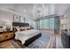 Spacious bedroom with a king-sized bed, designer rug, and lots of natural light at 219 George Hudson Rd, Siler City, NC 27344