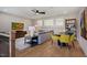Cozy living room with hardwood floors, a ceiling fan, and comfortable seating arrangement at 219 George Hudson Rd, Siler City, NC 27344