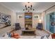 Bright living room offers a cozy brick fireplace and sliding door access to outdoor patio at 219 George Hudson Rd, Siler City, NC 27344
