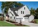 Stylish new construction home showing the three-car garage and attractive backyard landscaping at 219 George Hudson Rd, Siler City, NC 27344