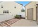 A quaint backyard featuring a private patio, enclosed by a white fence, leading to a convenient back door at 2211 Sweet Annie Way, Wake Forest, NC 27587