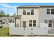 A well-maintained backyard with a white picket fence providing privacy and a green grassy area at 2211 Sweet Annie Way, Wake Forest, NC 27587