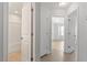 Hallway and bathroom entrances are shown with a bathtub and shower combination at 2211 Sweet Annie Way, Wake Forest, NC 27587