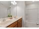 Bathroom shows a dual vanity and a tub/shower combination with built-in shelving at 2211 Sweet Annie Way, Wake Forest, NC 27587