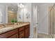 Bathroom boasts a dual sink vanity with granite counters, plus a glass shower stall at 2211 Sweet Annie Way, Wake Forest, NC 27587