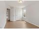 This bedroom is light and airy and boasts a neutral color palette and light-colored wood flooring at 2211 Sweet Annie Way, Wake Forest, NC 27587