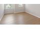 Bedroom showing the hardwood-style flooring and a view from the window at 2211 Sweet Annie Way, Wake Forest, NC 27587