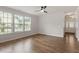 Bright and airy living room with wood floors, large windows, and neutral paint at 2211 Sweet Annie Way, Wake Forest, NC 27587