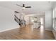 Spacious open floorplan showcases wood floors, stairs to the second floor, and a modern kitchen at 2211 Sweet Annie Way, Wake Forest, NC 27587