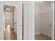 This spacious walk-in closet has a wire shelving system, and the adjacent hallway has extra storage at 2211 Sweet Annie Way, Wake Forest, NC 27587