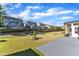 Well-kept backyard featuring a retaining wall, level lawn, and a patio, ideal for outdoor activities and relaxation at 2217 Holtwood Way, Apex, NC 27523