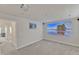Basement featuring a projector screen, gray carpet, and adjacent rooms at 2217 Holtwood Way, Apex, NC 27523