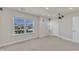 Finished basement with gray carpet, white walls, a window with natural light, and recessed lighting at 2217 Holtwood Way, Apex, NC 27523