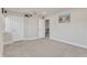 Finished basement with gray carpet, white walls, with doorways and a view of the stairway at 2217 Holtwood Way, Apex, NC 27523