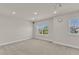 Finished basement with gray carpet, white walls, a window with neighborhood view, and recessed lighting at 2217 Holtwood Way, Apex, NC 27523