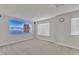 Basement with projector screen, gray carpet, and a window offering natural light at 2217 Holtwood Way, Apex, NC 27523