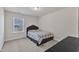 Bedroom featuring carpet, a window, and a bed with plaid blanket at 2217 Holtwood Way, Apex, NC 27523
