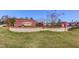 Community entrance with stone and brick architecture and fresh landscaping at 2217 Holtwood Way, Apex, NC 27523