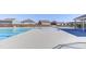 Community pool with zero entry and splash pad with neighborhood homes in the background at 2217 Holtwood Way, Apex, NC 27523