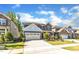 Charming two-story home with stone accents, red shutters, landscaped yard, and a two-car garage at 2217 Holtwood Way, Apex, NC 27523